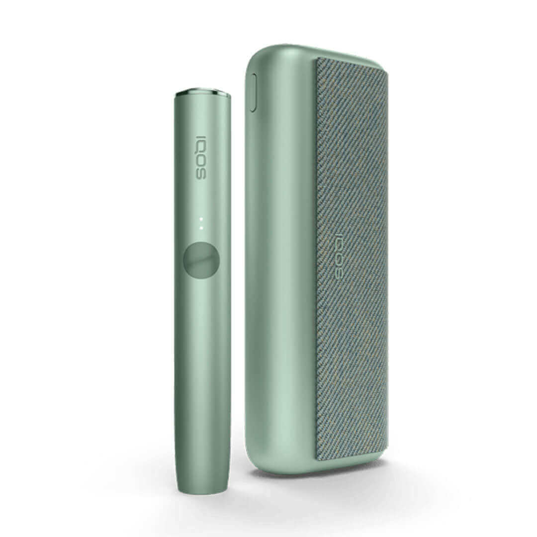  IQOS Iluma Prime UK. Showcasing the Green colour variation of the IQOS Iluma Prime. IQOS Iluma Prime on white background with shadow included. All colours of the IQOS Iluma Prime at 888 Vapour available from £108.99 with 60 free terea sticks. 3 Packs of 