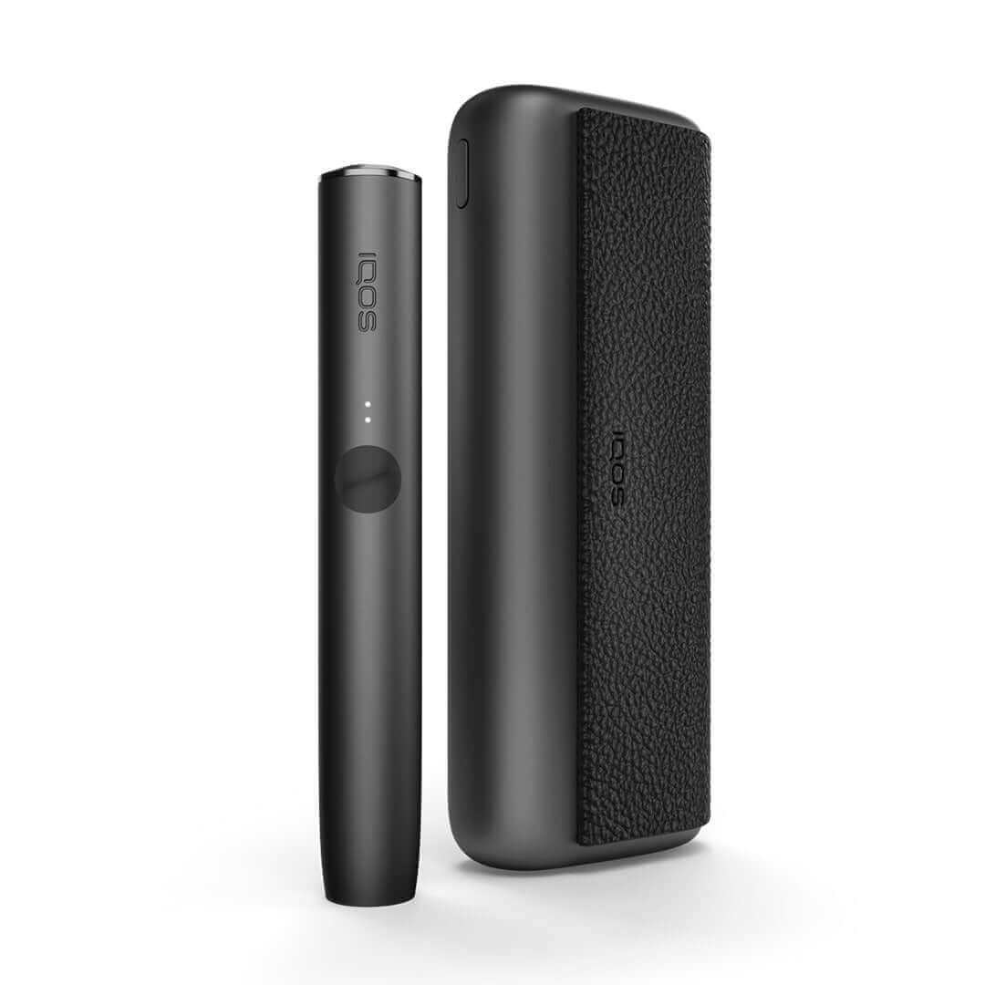  IQOS Iluma Prime UK. Showcasing the Obsidian Black colour variation of the IQOS Iluma Prime. IQOS Iluma Prime on white background with shadow included. All colours of the IQOS Iluma Prime at 888 Vapour available from £108.99 with 60 free terea sticks. 3 